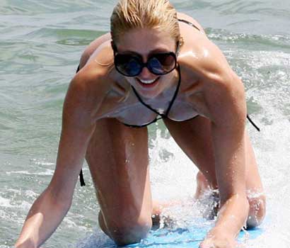 Paris Hilton goes surfing